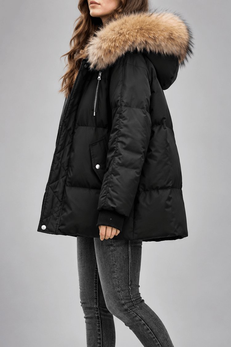 Oversized black puffer jacket with a plush-trim hood, diamond-quilted placket, and ribbed knit cuffs.