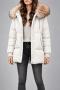 Oversized white puffer jacket with a plush-trim hood, quilted snap placket, and ribbed knit cuffs worn over dark jeans.