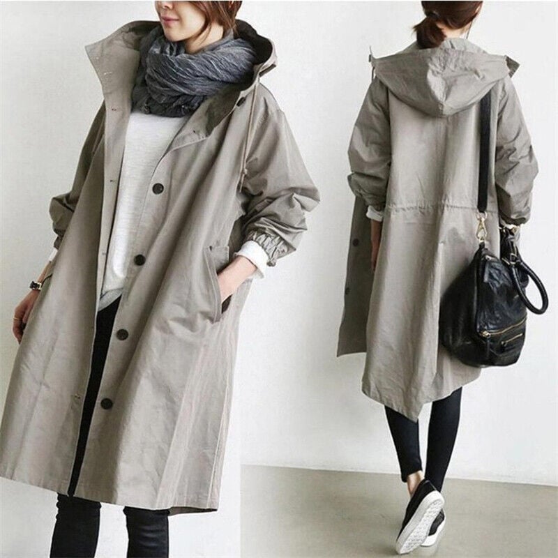 Oversized gray hooded trench coat in lightweight fabric with a button-front placket, slant pockets, and a relaxed knee-length fit.