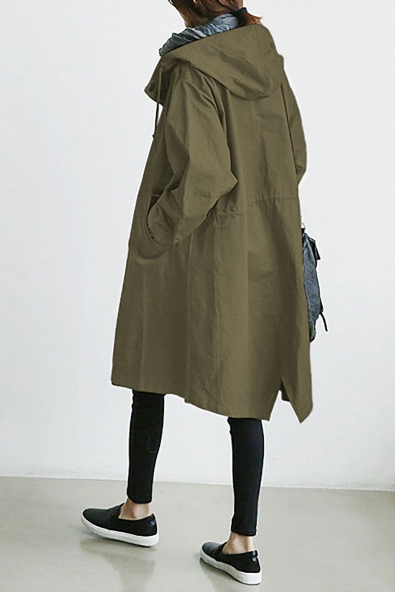 Oversized olive green hooded trench coat in lightweight fabric with a relaxed knee-length fit and side pockets.