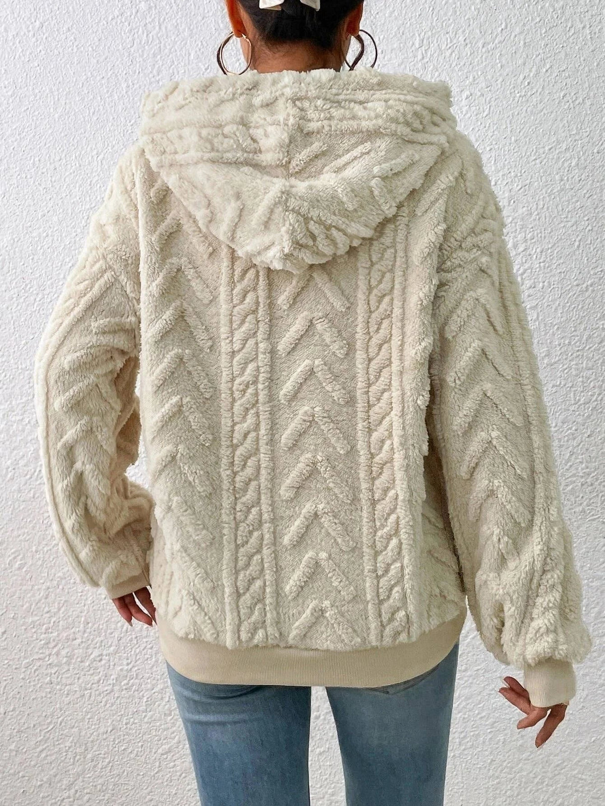 Oversized Plush Fleece Hoodie – Cream hoodie shown from the back with raised chevron cable pattern