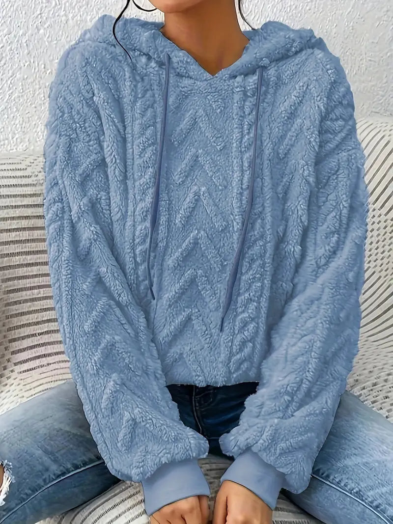 Oversized Plush Fleece Hoodie – Light blue hoodie worn by a female model with raised chevron cable pattern