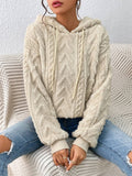Oversized Plush Fleece Hoodie – Cream hoodie worn by a female model with raised chevron cable pattern and ribbed cuffs