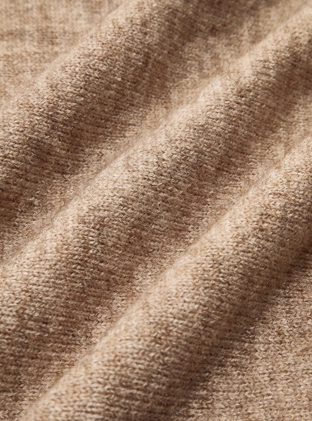 Macro close-up view showing the soft, ribbed knit texture and diagonal weave of the lounge set material.