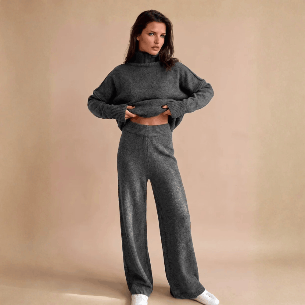 Full-length front view of a model wearing the oversized turtleneck ribbed lounge set in charcoal gray.