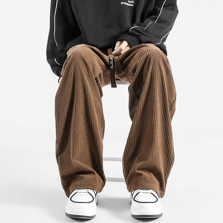 Brown pinwale corduroy pants styled with sneakers and a casual top