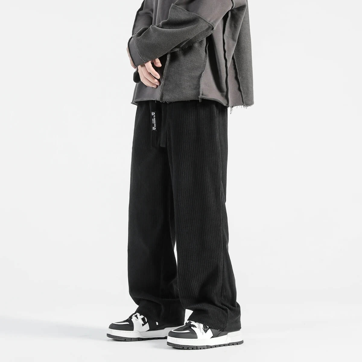 Black straight-leg corduroy pants with elastic waist and relaxed fit