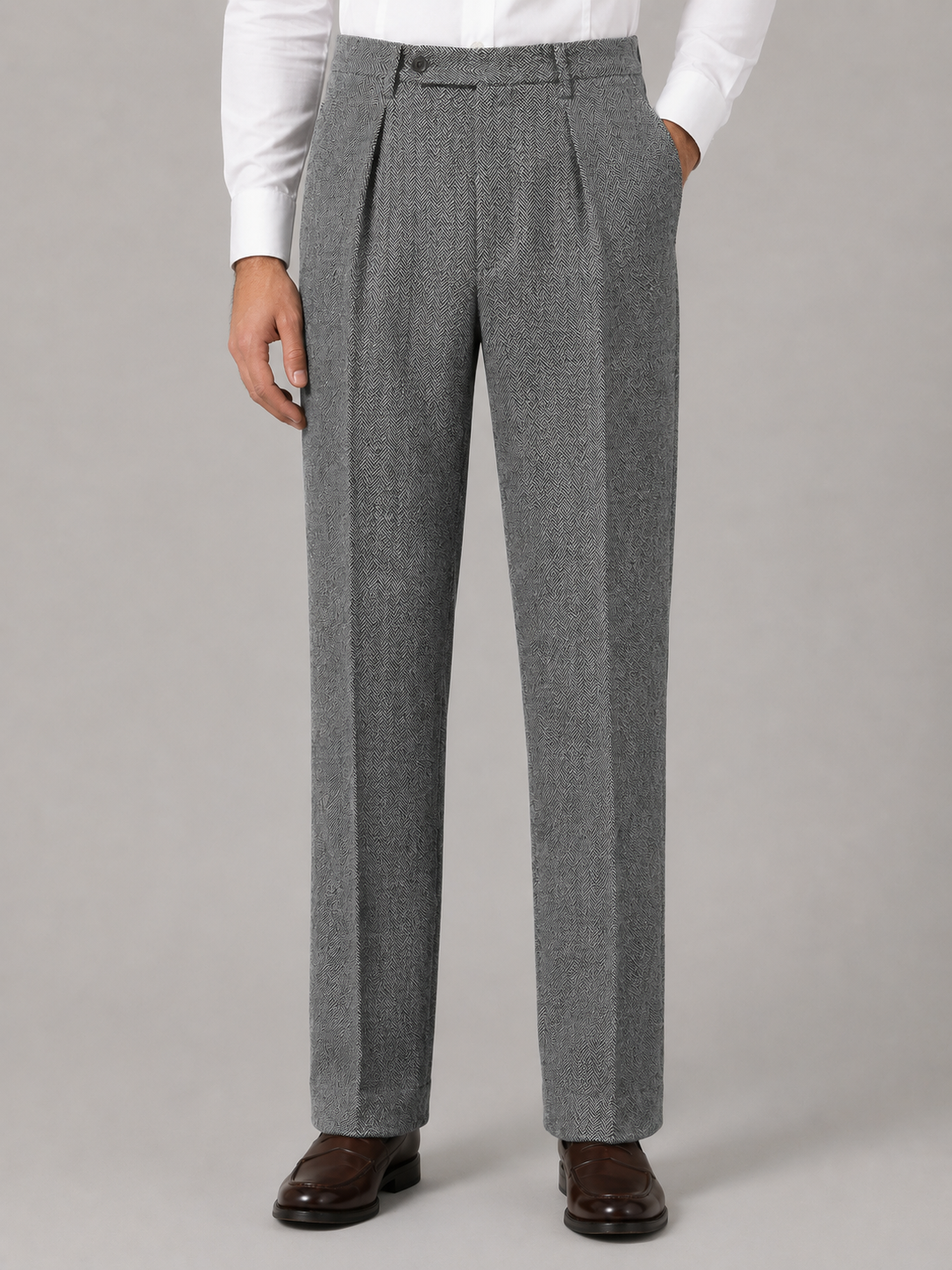 Gray herringbone pleated trousers in a high-rise, straight-leg cut with a tailored fit and side pockets.