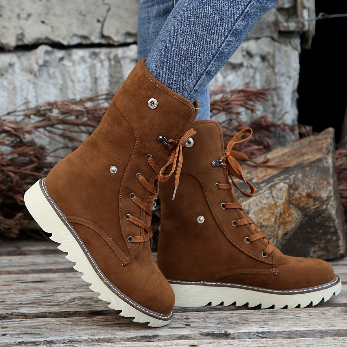 Dark brown vegan suede ankle boots for women with plush collar folded down over the laces
