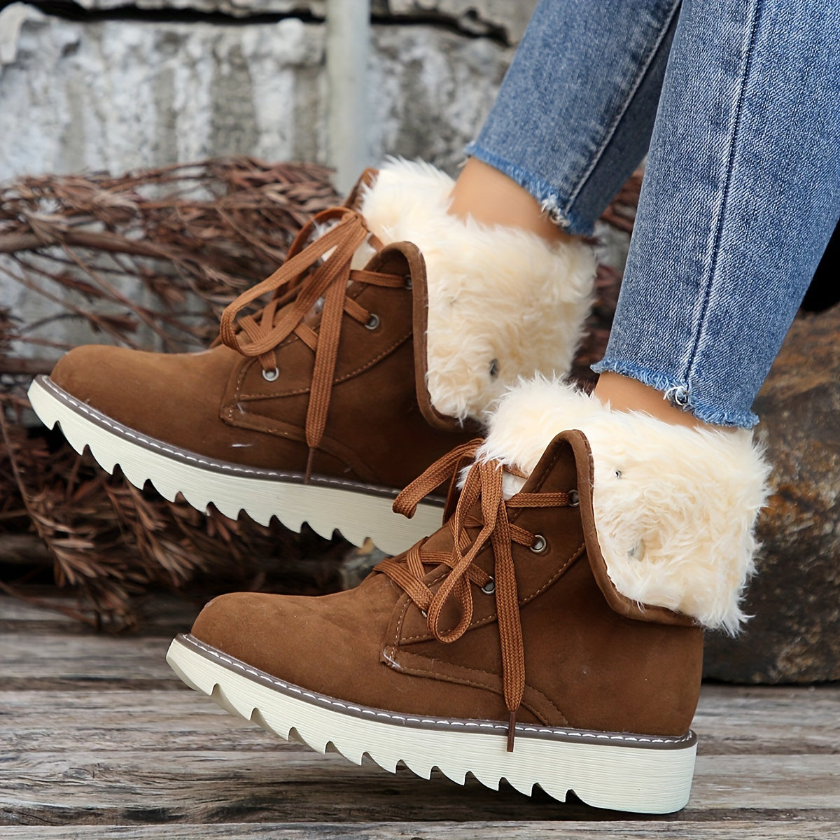 Dark brown plush collar ankle boots for women with lace-up front, worn with cropped jeans