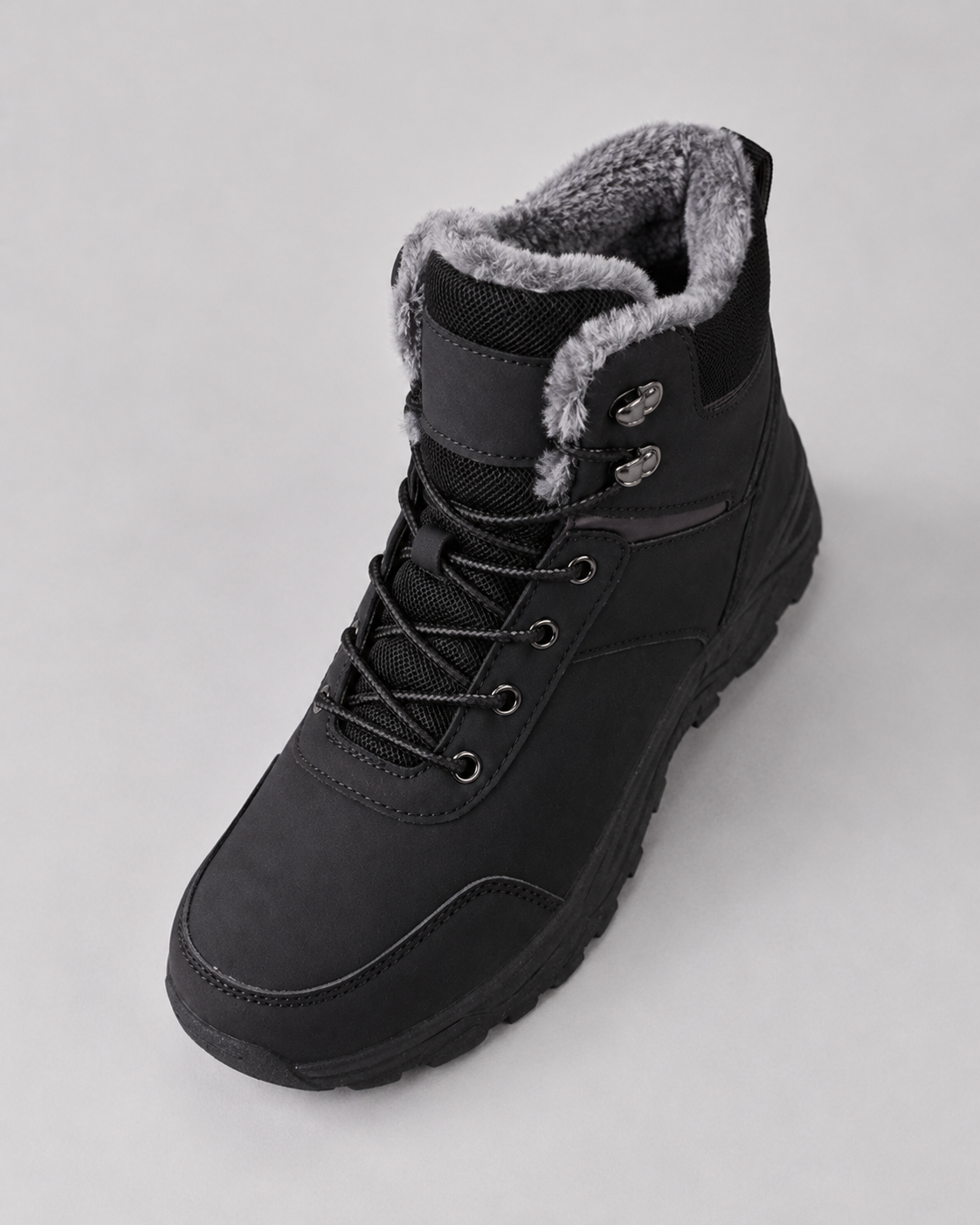 Black ankle boots with plush-lined collars, rugged lug soles, and secure metal lace-up speed hooks.