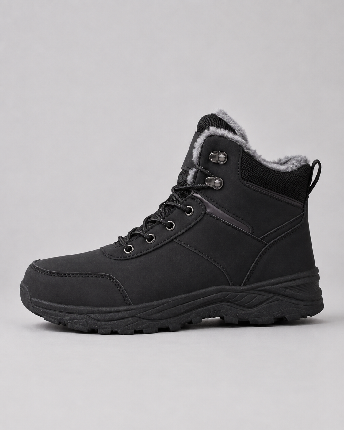 Black ankle boots featuring a plush-lined collar, rugged lug sole, and a secure lace-up design with metal speed hooks.