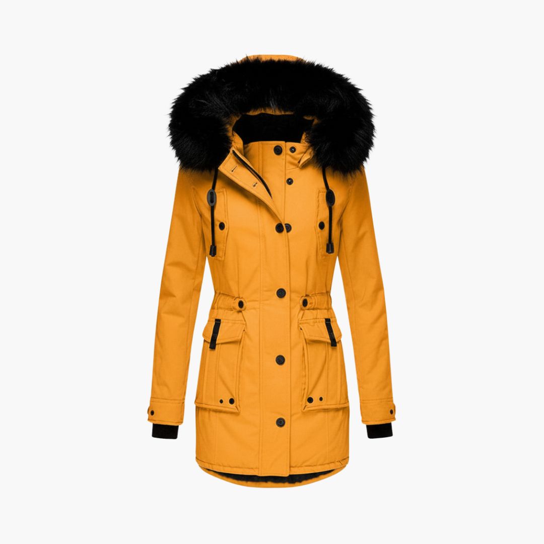 Dark Yellow Plush-Trim Hooded Parka – Leona featuring a black plush-trimmed hood, button placket, flap pockets, waist tabs, and fitted silhouette.