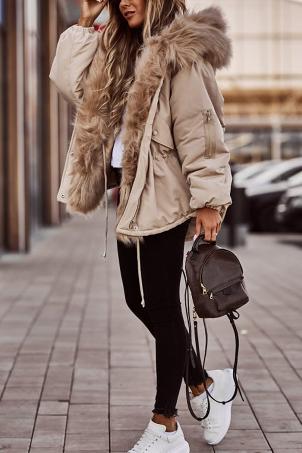 Beige  Plush-Trim Hooded Parka worn outdoors, featuring a plush-trimmed hood, drawstring waist, zip sleeve pocket, and longline silhouette.