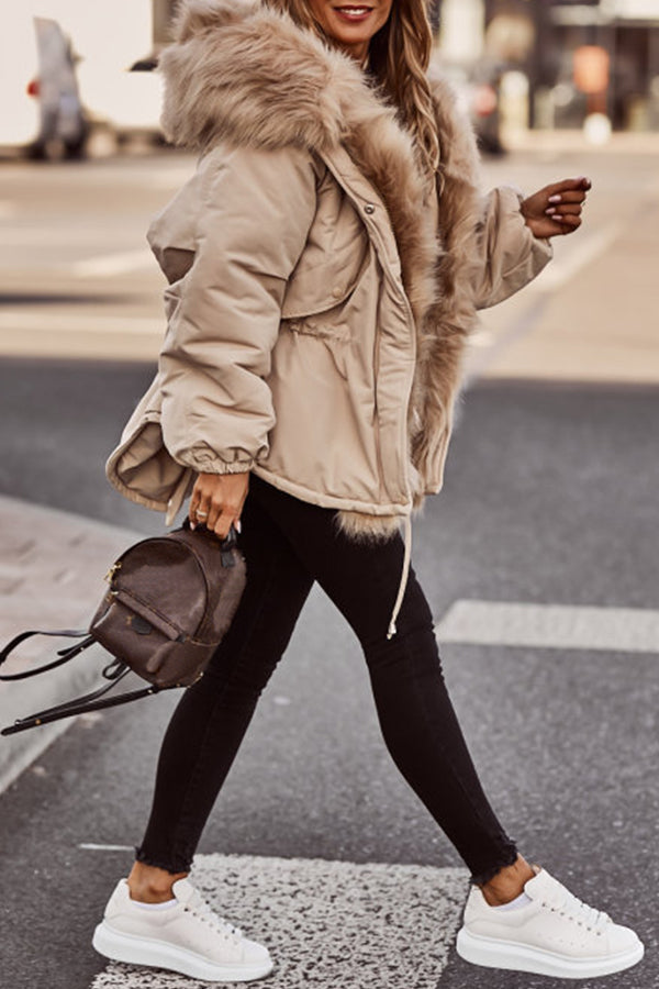 Beige Plush-Trim Hooded Parka worn outdoors, showcasing the plush-trimmed hood, drawstring waist, zip sleeve pocket, and front zip closure.