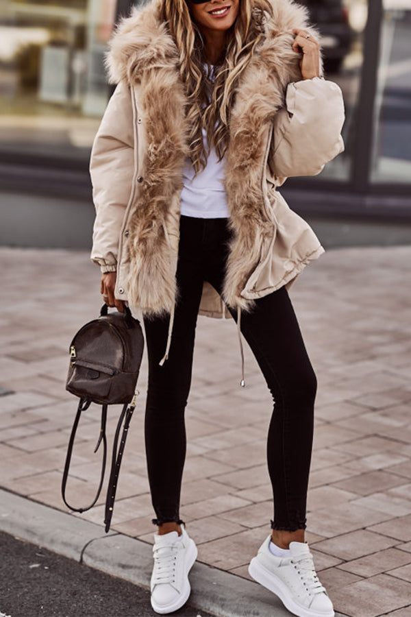Beige Plush-Trim Hooded Parka worn by a female model, featuring a plush-trimmed hood, drawstring waist, zip sleeve pocket, and longline fit.