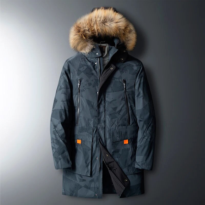 Charcoal gray utility parka featuring a geometric print, plush-trim hood, zip chest pockets, and orange-tabbed cargo pockets.