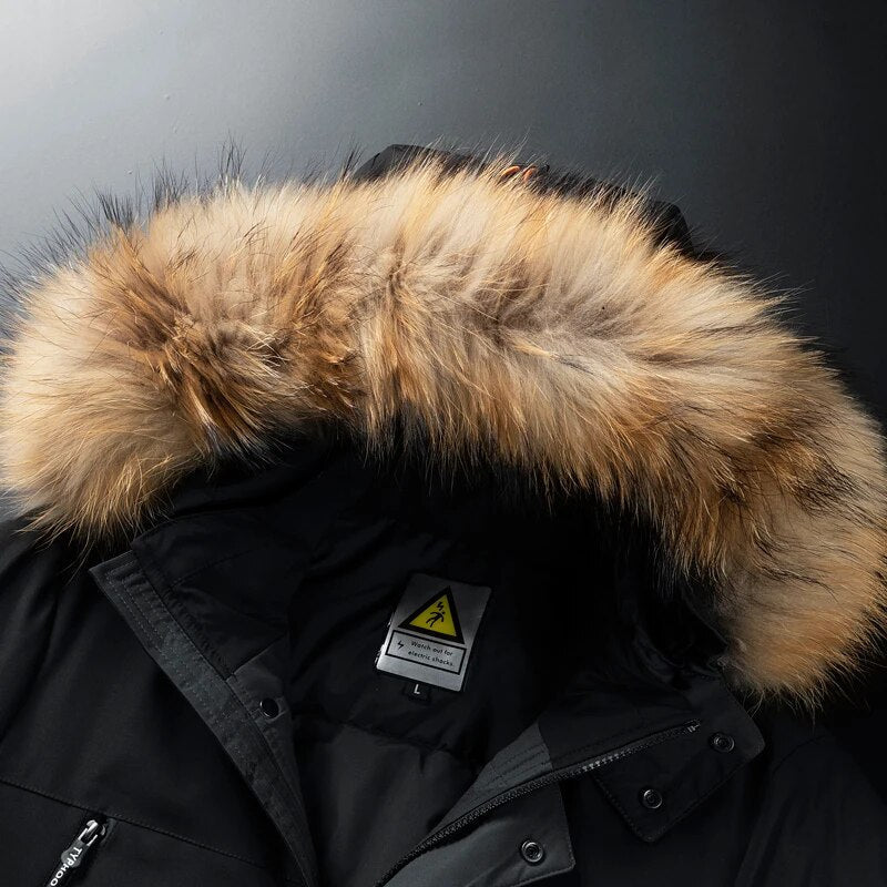 Black utility parka with a detachable hood featuring thick, textured faux-fur trim and a high-neck zip closure.