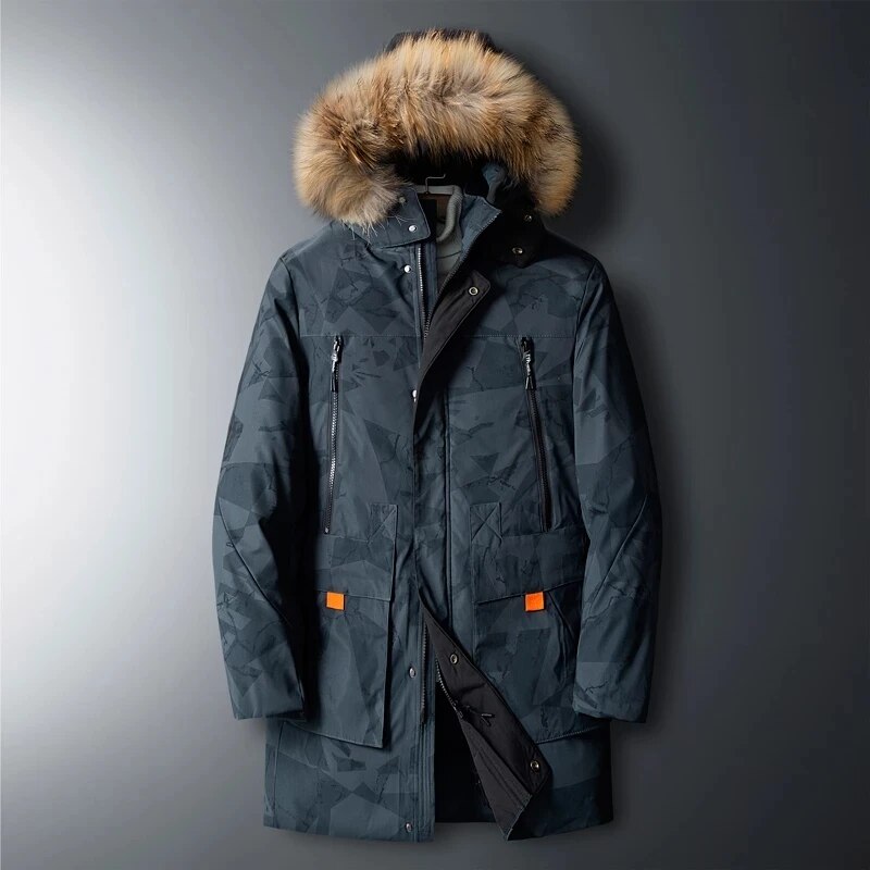 Charcoal gray utility parka with geometric print, plush-trim hood, vertical zip chest pockets, and orange-tabbed cargo pockets.