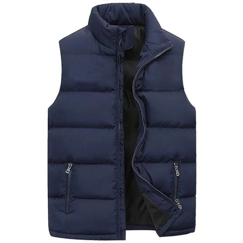 Front product view of the stand-collar channel-quilted puffer vest in dark navy blue shown partially unzipped with contrast inner lining.
