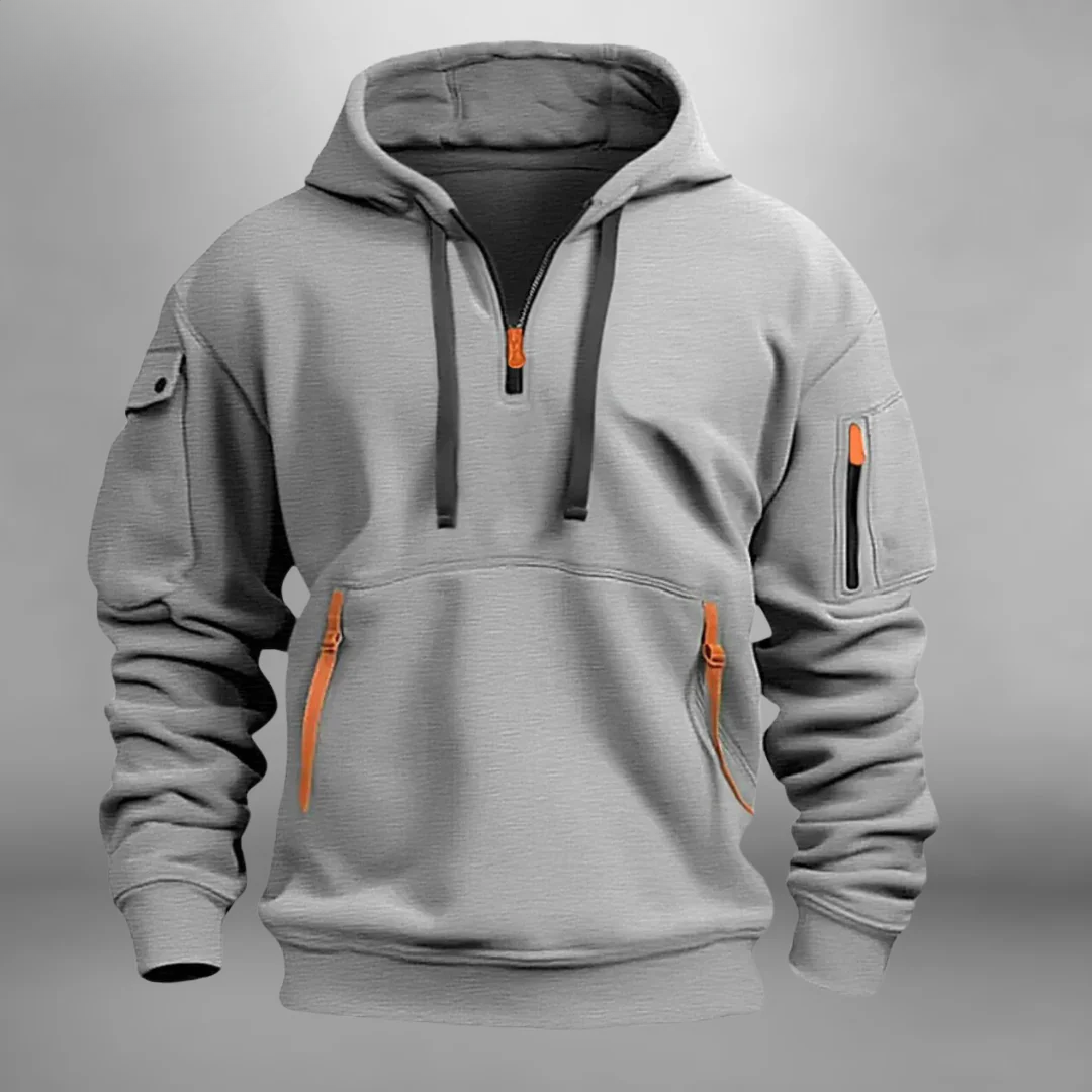 Gray quarter-zip tactical hoodie shown in a close-up front view with utility pockets and contrast zipper details.