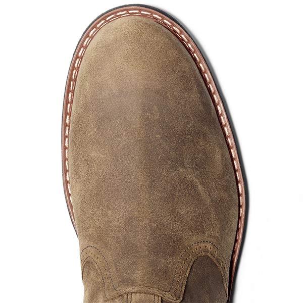 Close-up of the rounded toe and stitched welt detailing on the tan Chelsea boot.