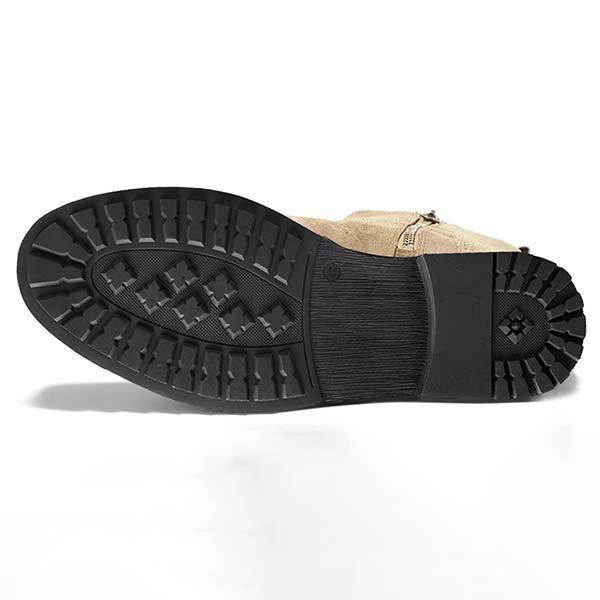 Bottom view of a tan Chelsea boot showing the textured tread pattern.