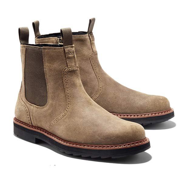 Pair of tan suede Chelsea boots with elastic side panels, pull tabs, stitched detailing, and rugged rubber soles.