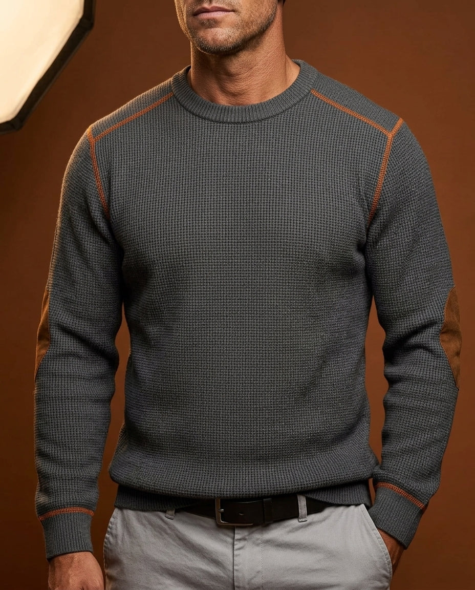 Dark Gray textured crew neck knit sweater with contrast shoulder trim, long sleeves, and ribbed cuffs, styled with light trousers.