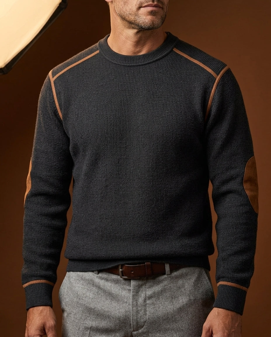 Black textured crew neck knit sweater featuring contrast shoulder trim, long sleeves, and ribbed cuffs, paired with gray trousers.