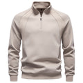 Beige raglan quarter-zip sweatshirt shown from the front on a mannequin.