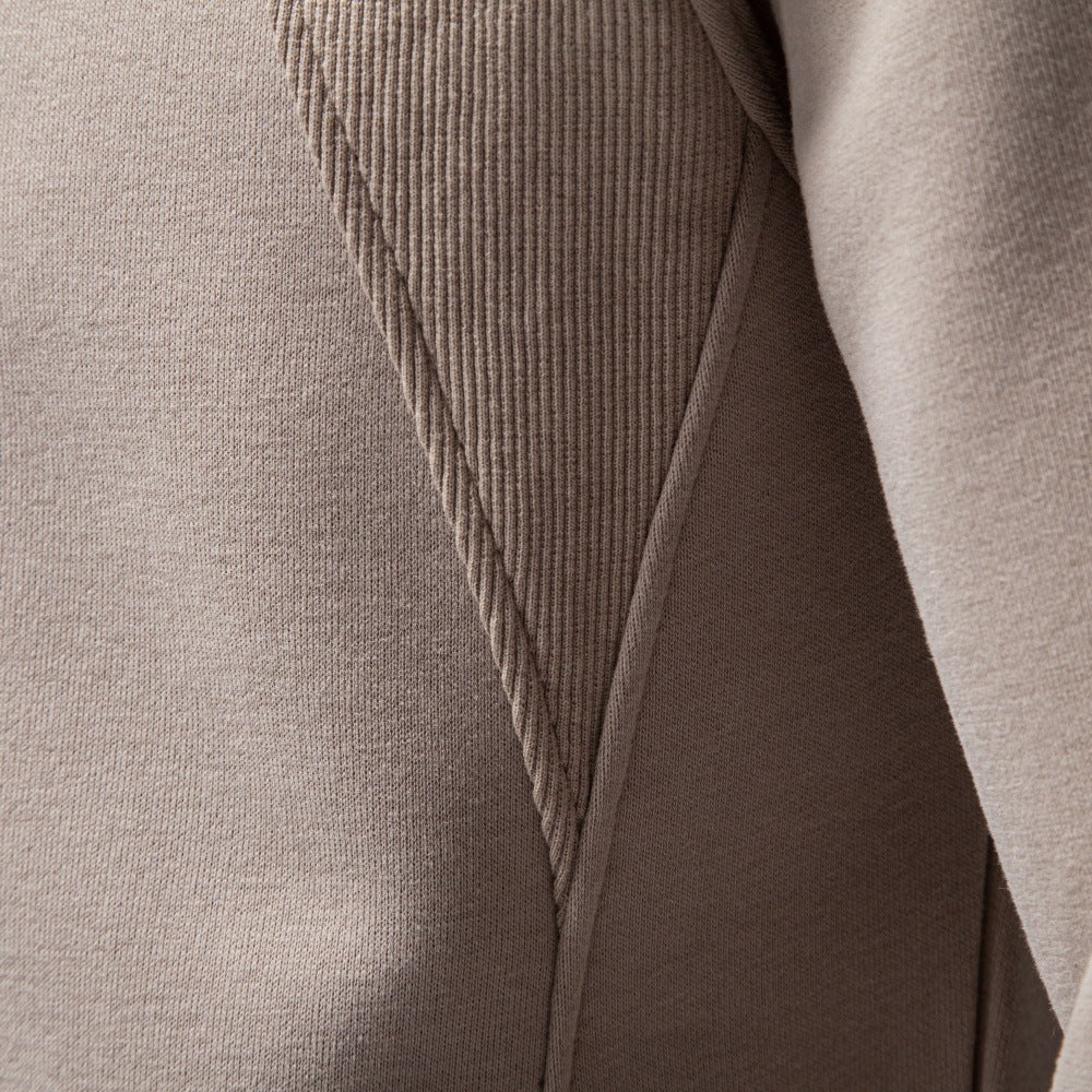 Close-up of the sweatshirt’s sleeve and textured shoulder panel.