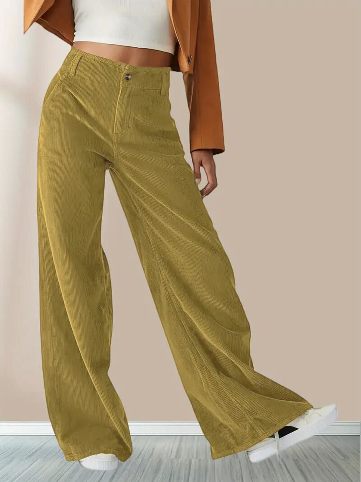 Yellow wide-leg corduroy pants with a button-zip fly, slant pockets, and a relaxed, flowing silhouette.