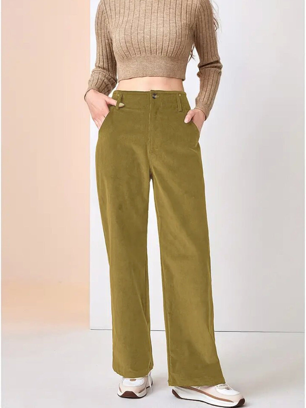 Yellow wide-leg corduroy pants featuring a button-zip fly, belt loops, and slant pockets in a relaxed, fluid fit.