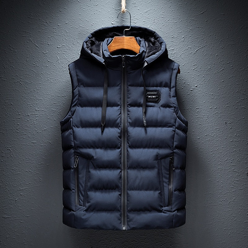 Front product hanging view of the reversible hooded channel-quilted puffer vest in navy blue.
