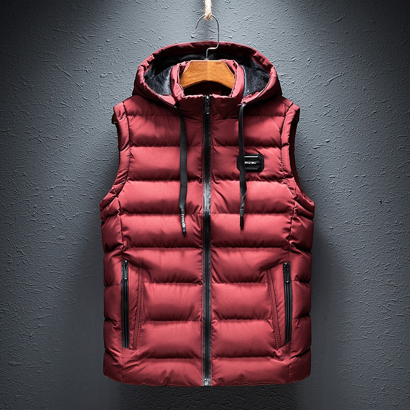 Front product hanging view of the reversible hooded channel-quilted puffer vest in red.