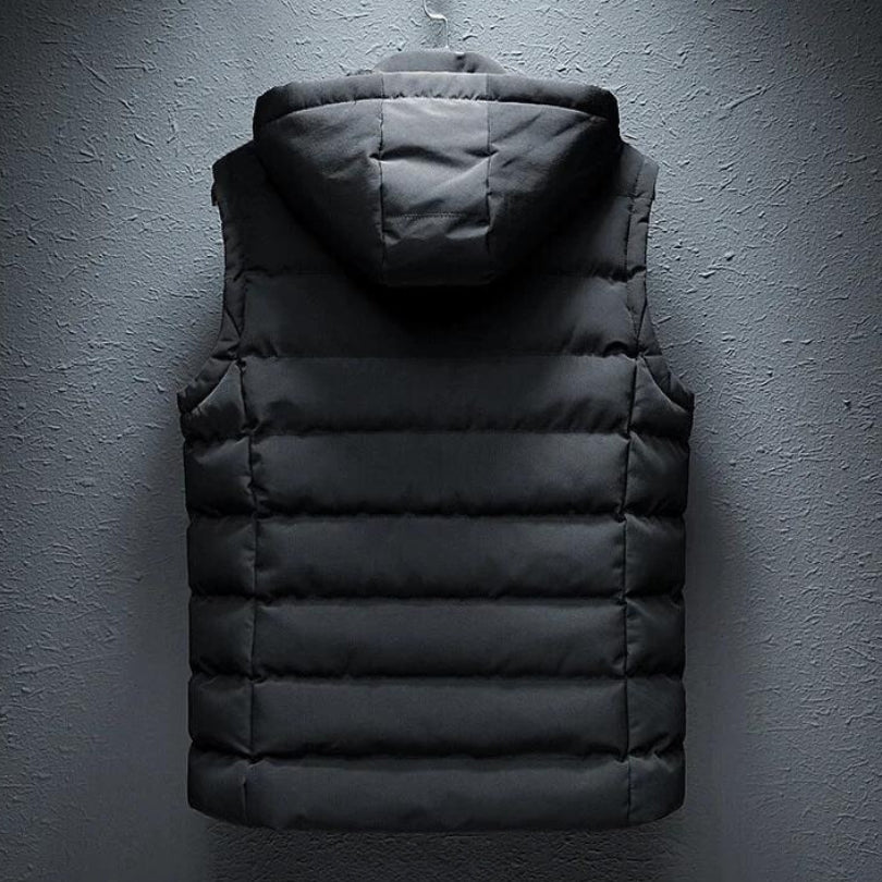 Full back product hanging view of the classic black reversible hooded puffer vest showing the horizontal channel quilting and hood.