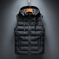 Full front product hanging display of a classic black reversible hooded puffer vest featuring horizontal channel quilting, a full-zip front closure, chest rubber logo patch, and drawstring hood.