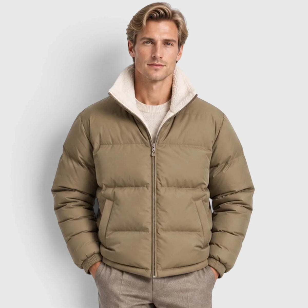 khaki reversible puffer jacket with wide channel quilting, plush stand collar, and rib-knit cuffs on a man.