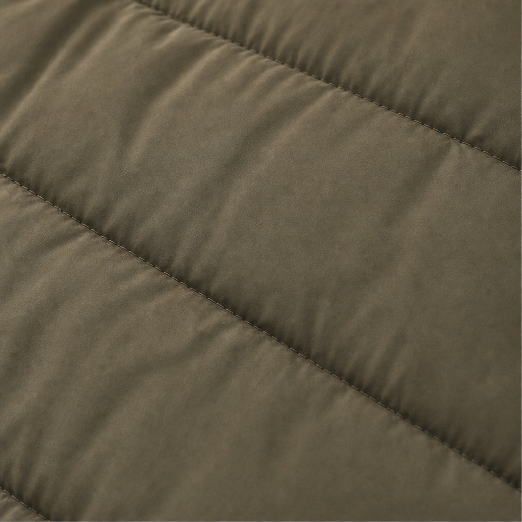 Olive green quilted puffer fabric with horizontal stitching detail.