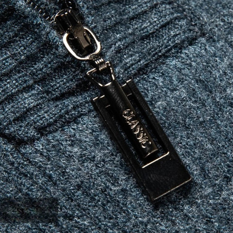 Close-up of the quarter-zip collar and contrast shoulder piping detail.