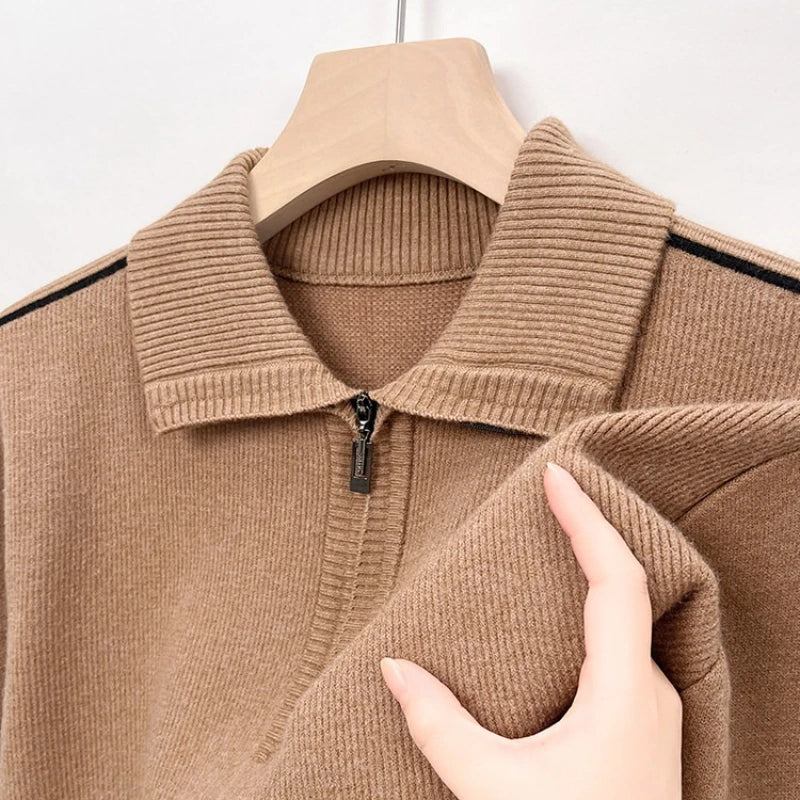 Beige ribbed knit quarter-zip polo shown on a hanger.