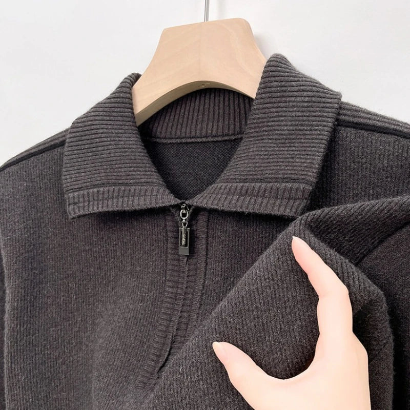 Dark gray ribbed knit quarter-zip polo shown on a hanger