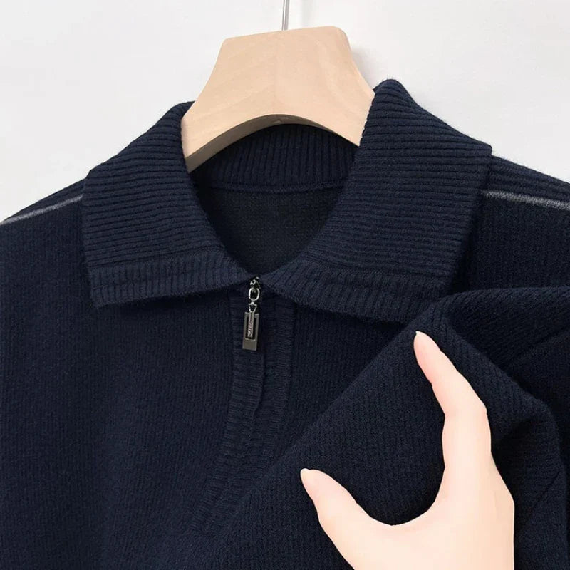 Navy blue ribbed knit quarter-zip polo shown on a hanger.