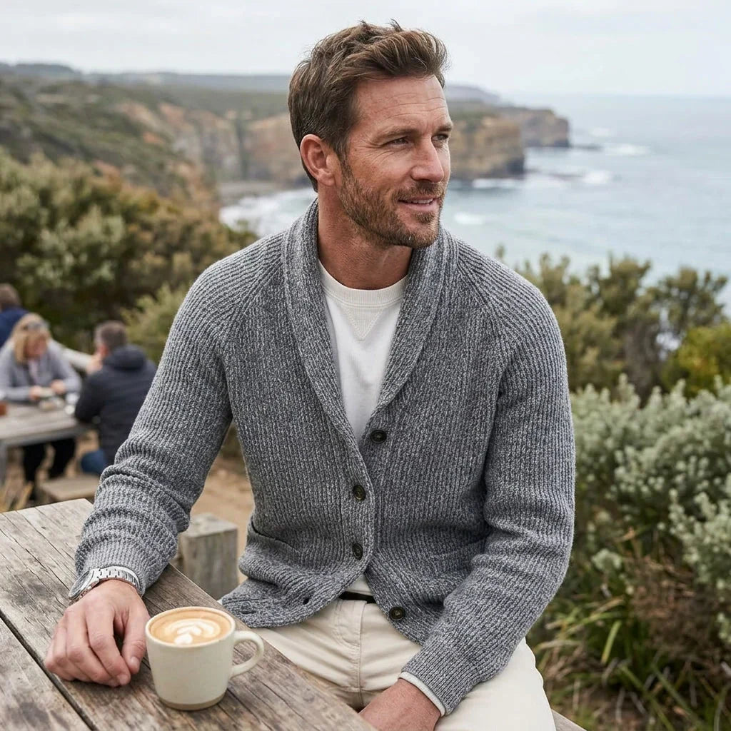 Gray ribbed knit shawl collar cardigan with raglan sleeves and a button front, worn over a white tee outdoors.