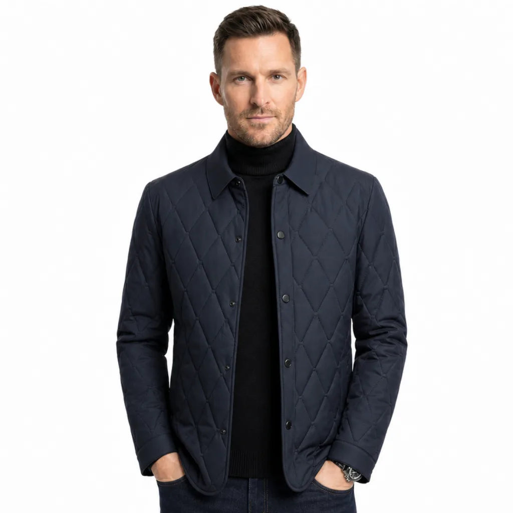 Man wearing a navy quilted casual jacket with a classic collar, button-front closure, and diamond quilted front panel.
