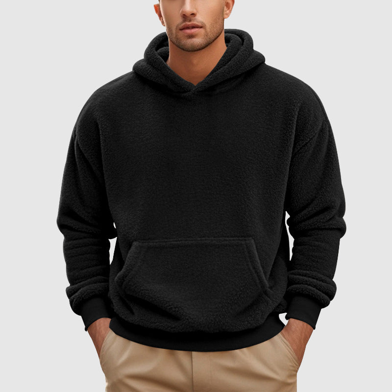 Sherpa Fleece Pullover Hoodie – Black hoodie worn by a male model with relaxed fit and kangaroo pocket