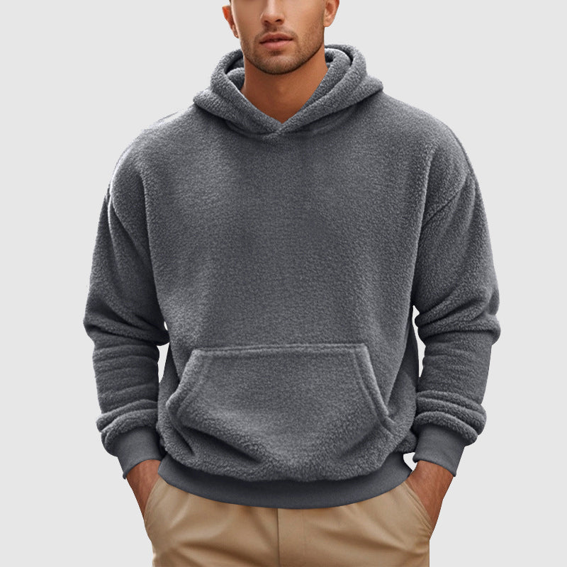 Sherpa Fleece Pullover Hoodie – Gray hoodie worn by a male model with kangaroo pocket and ribbed cuffs