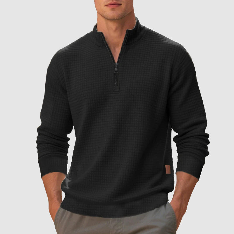 Black waffle knit quarter-zip pullover with a stand collar, ribbed cuffs, and a trim, regular fit.