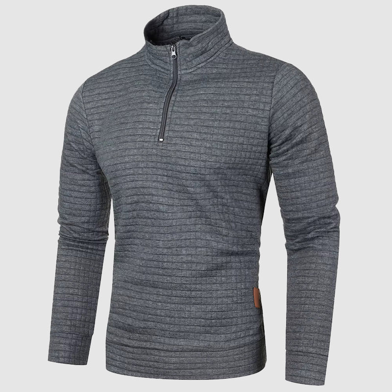 Charcoal grey waffle knit quarter-zip pullover with a stand collar, ribbed cuffs, and a trim, mid-weight fit.